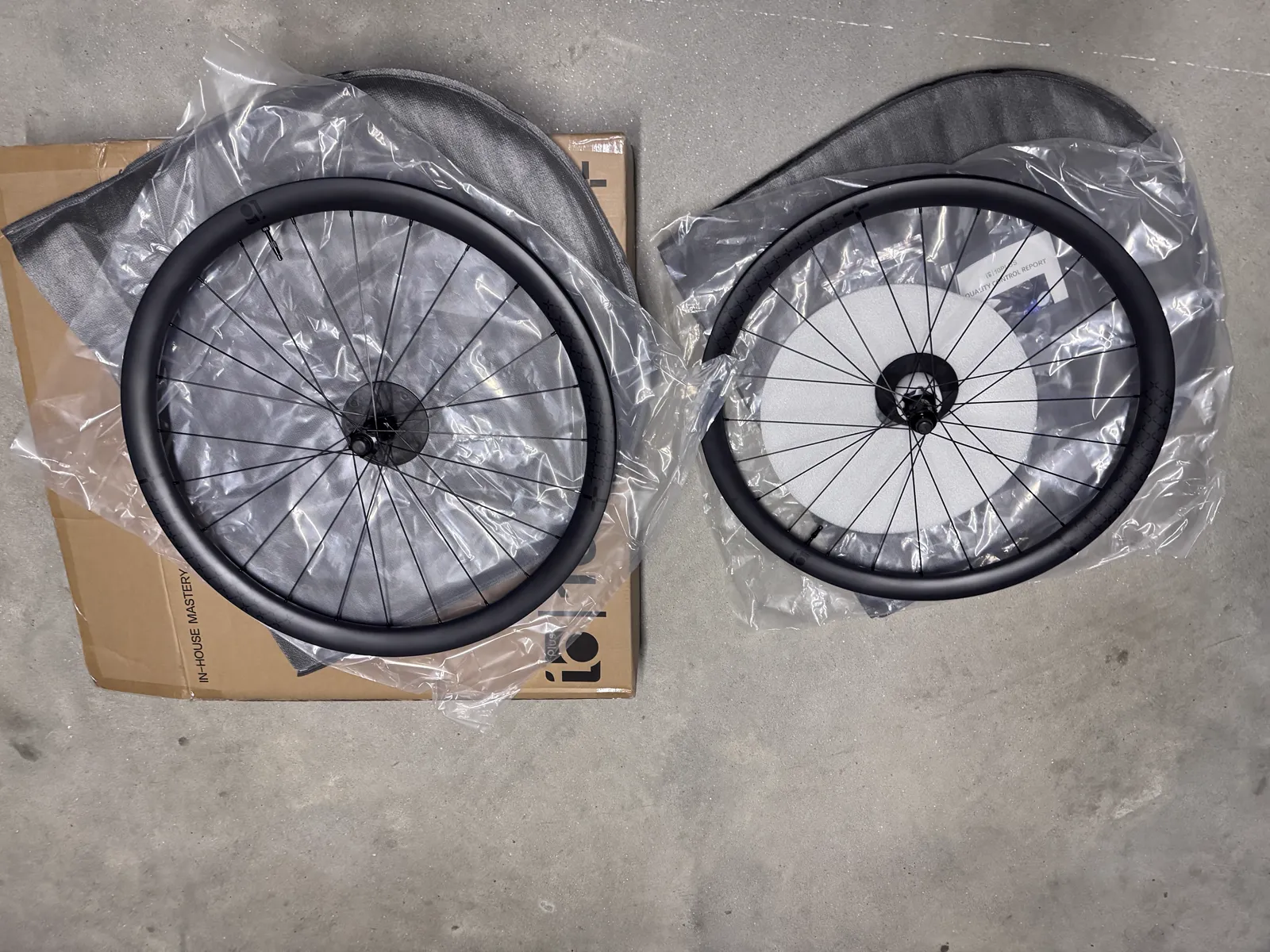 Front and rear 10PLUS wheels, each still in its own plastic bag